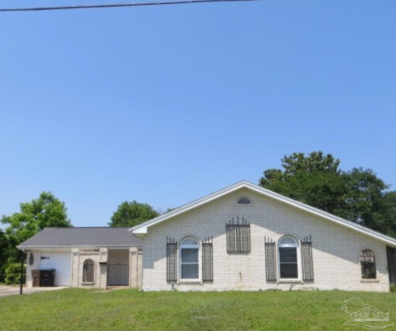 a front view of a house with yard