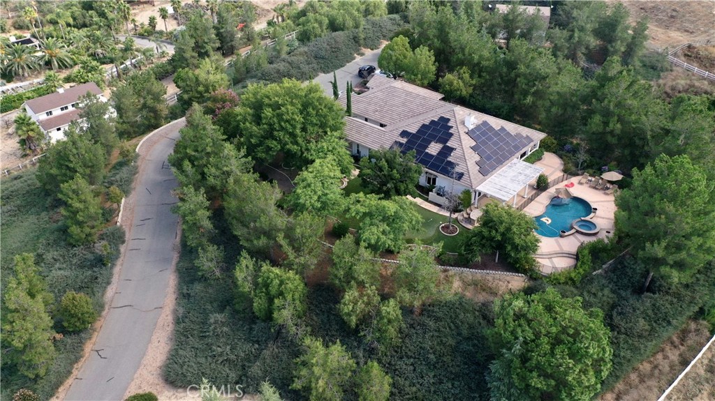 an aerial view of house with yard