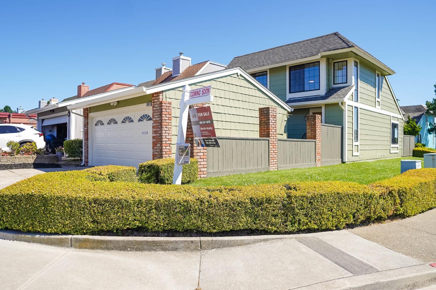 a front view of a house with a yard