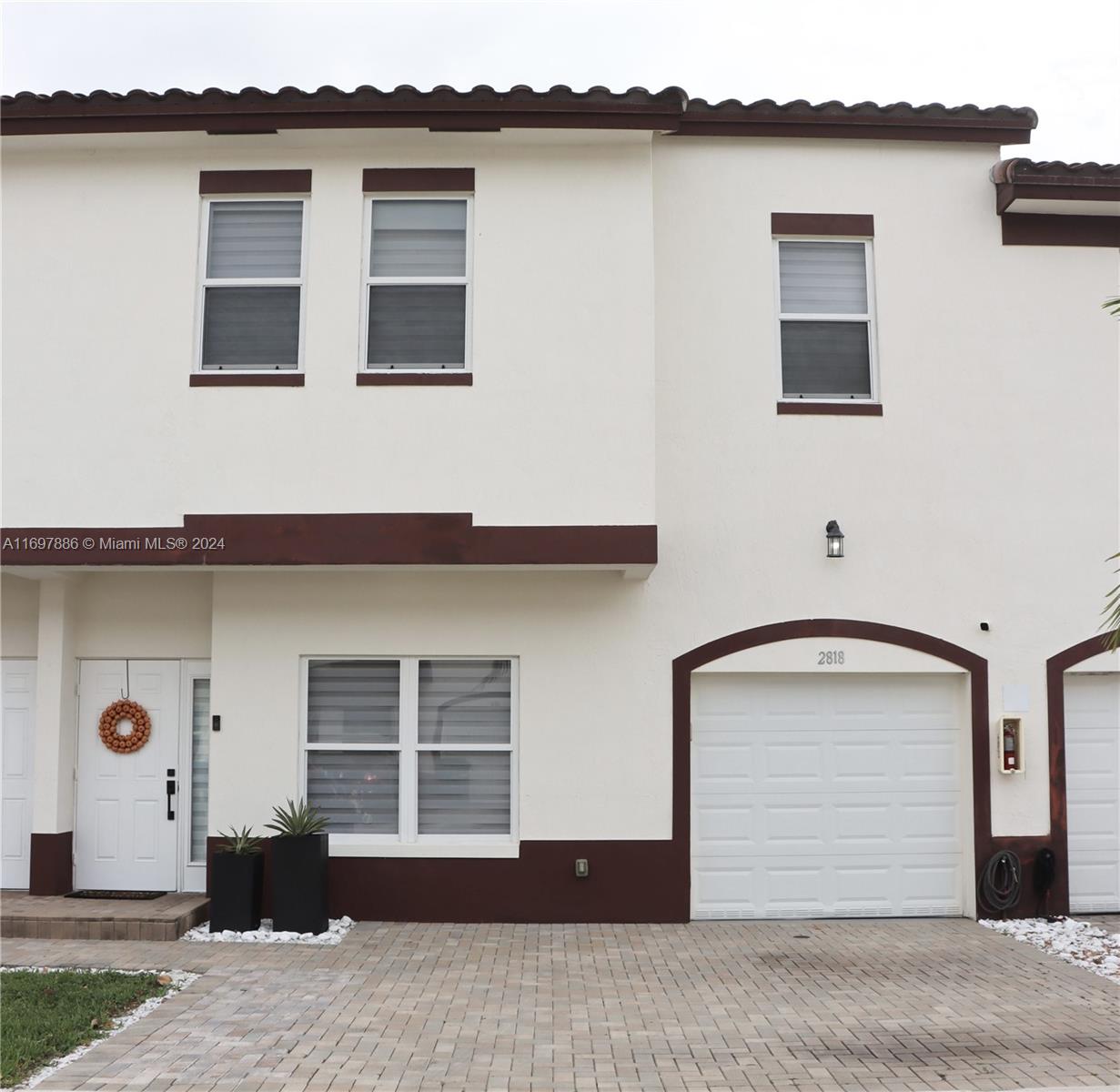 a front view of a house with a garage