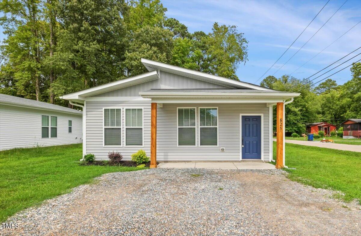 front view of a house with a yard