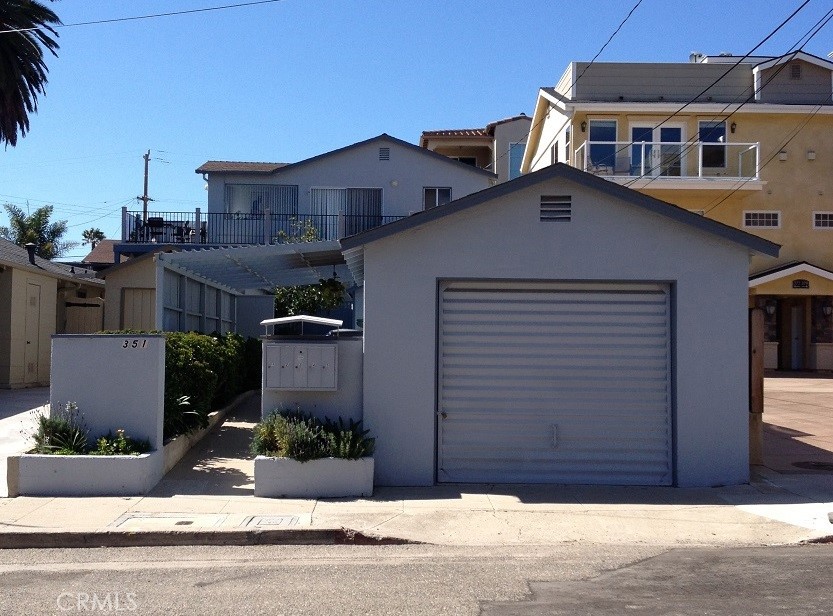 a view of a house with a wooden fence