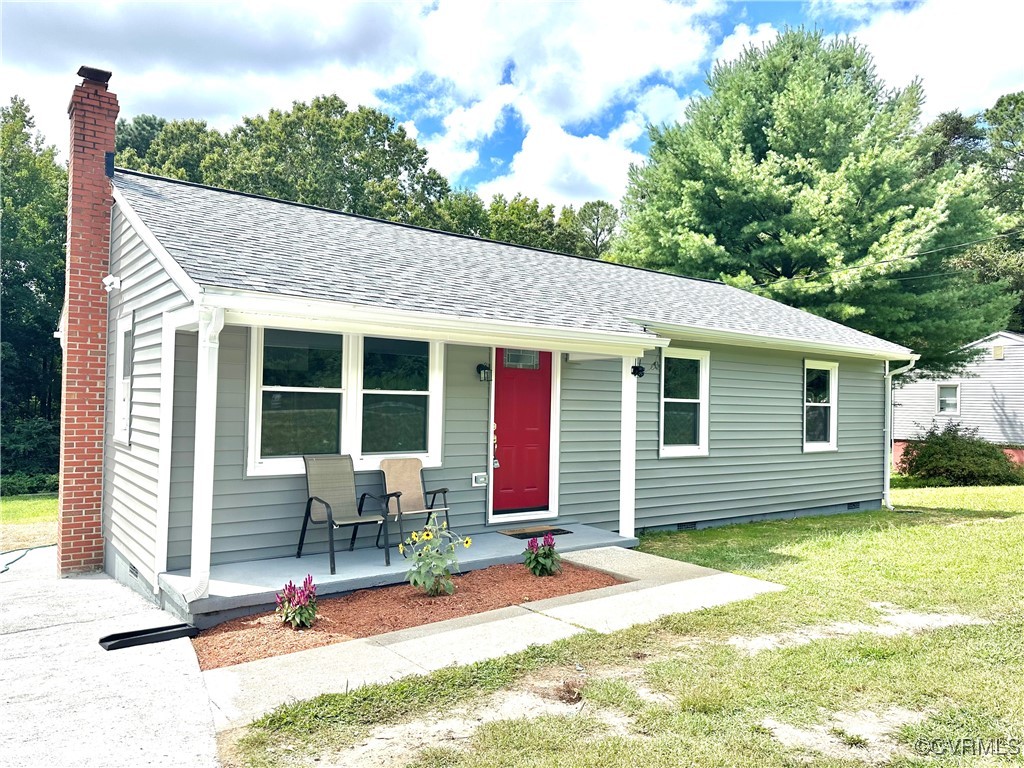 View of front facade featuring covered porch and a