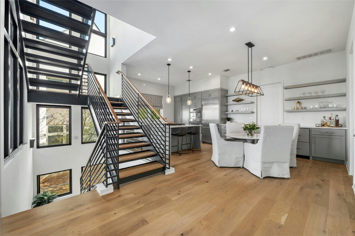 a view of kitchen with furniture and a wooden floor