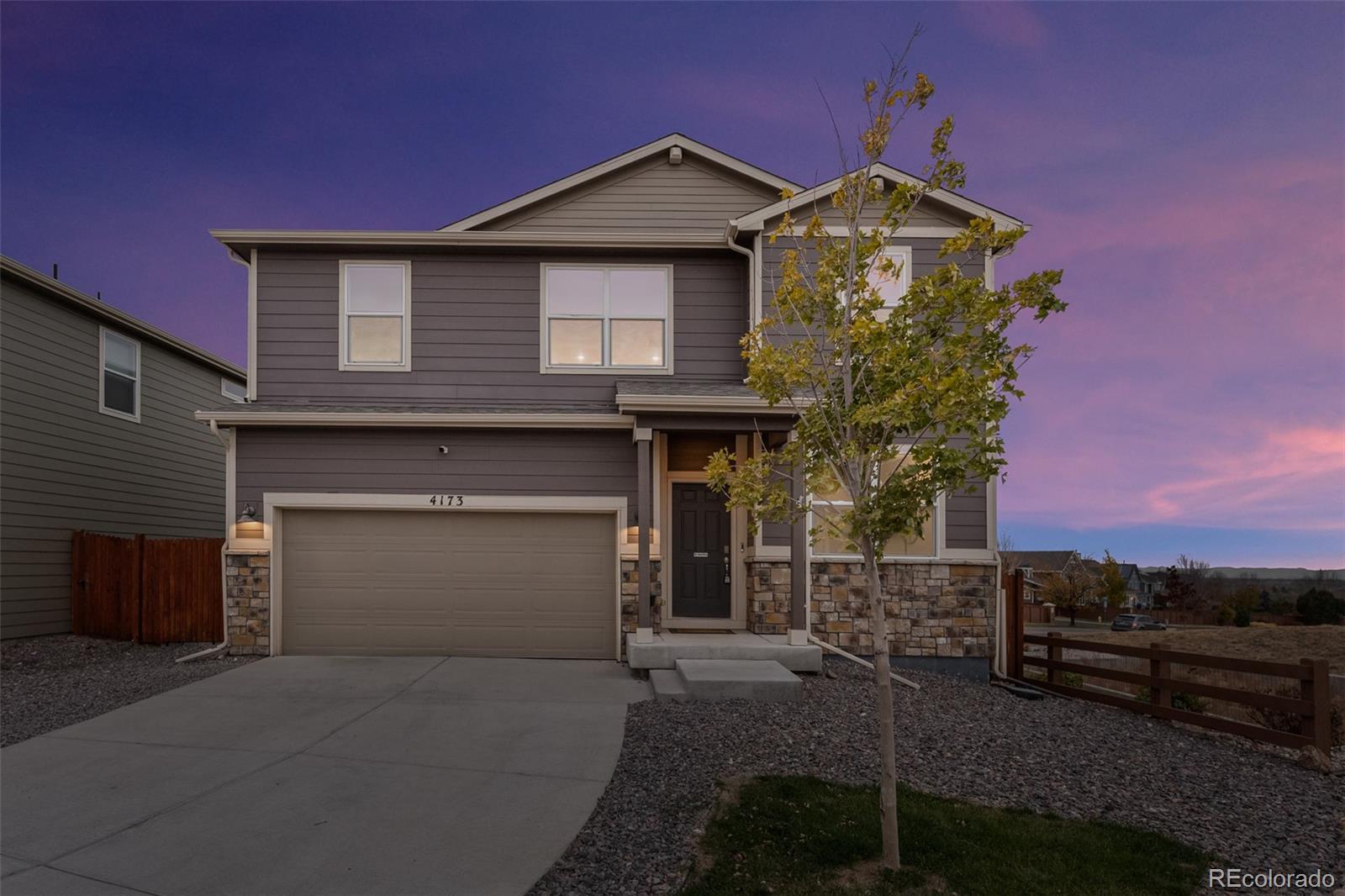 a front view of a house with a garage