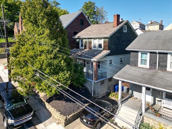 a aerial view of a house with a yard