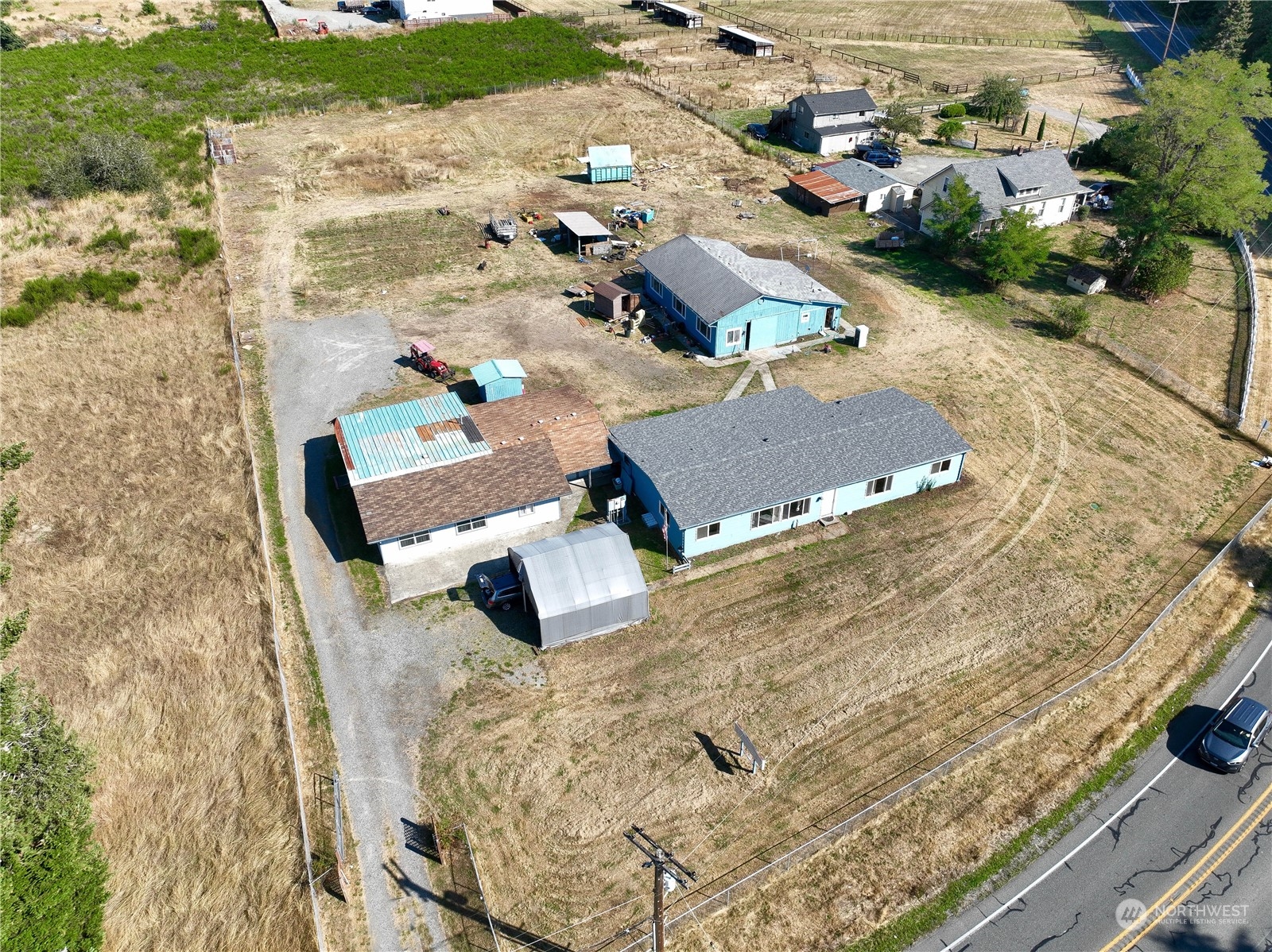 an aerial view of residential houses with outdoor space