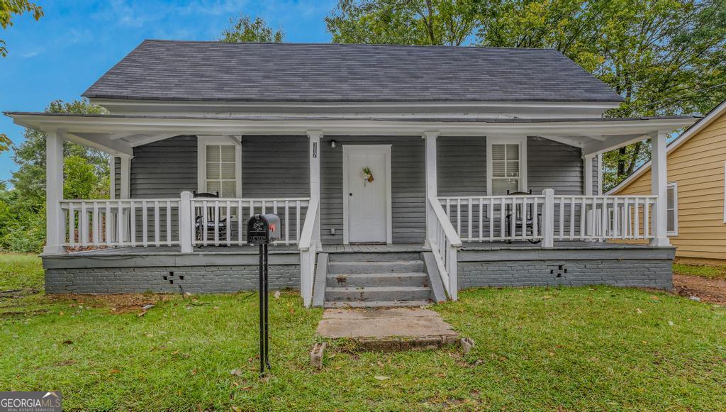 front view of a house with a yard