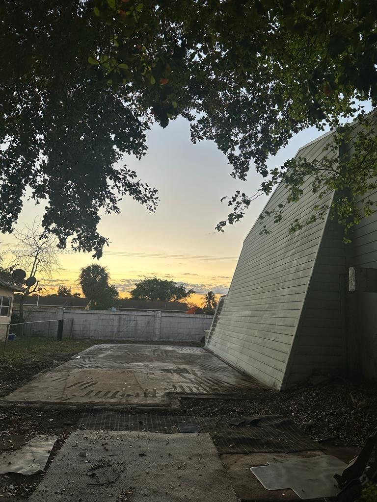 a view of a yard with an outdoor space