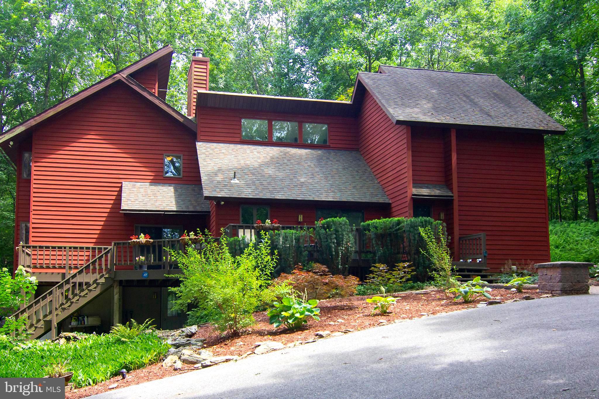 a front view of a house with a yard and a garage