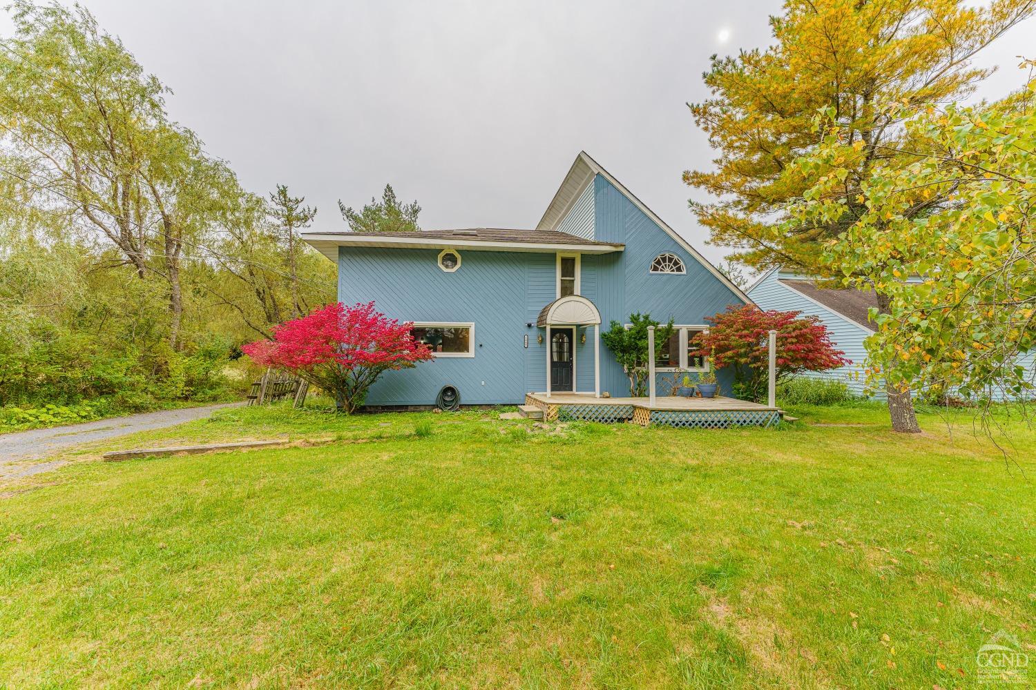 a front view of house with yard and seating area