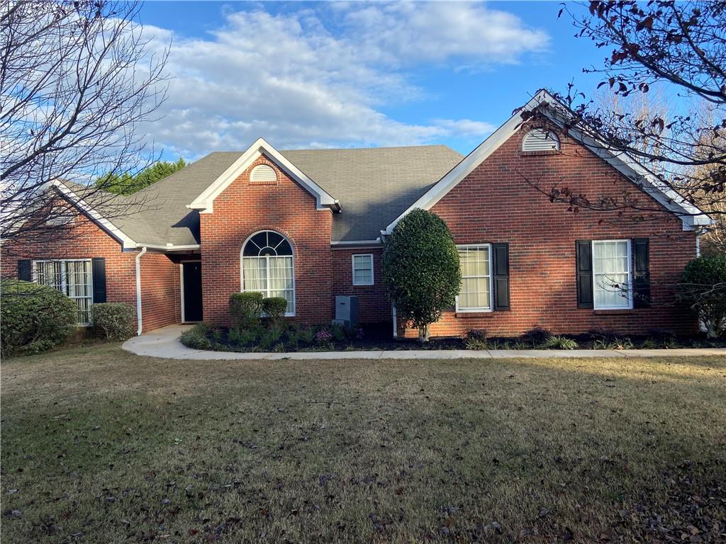 a front view of a house with a yard