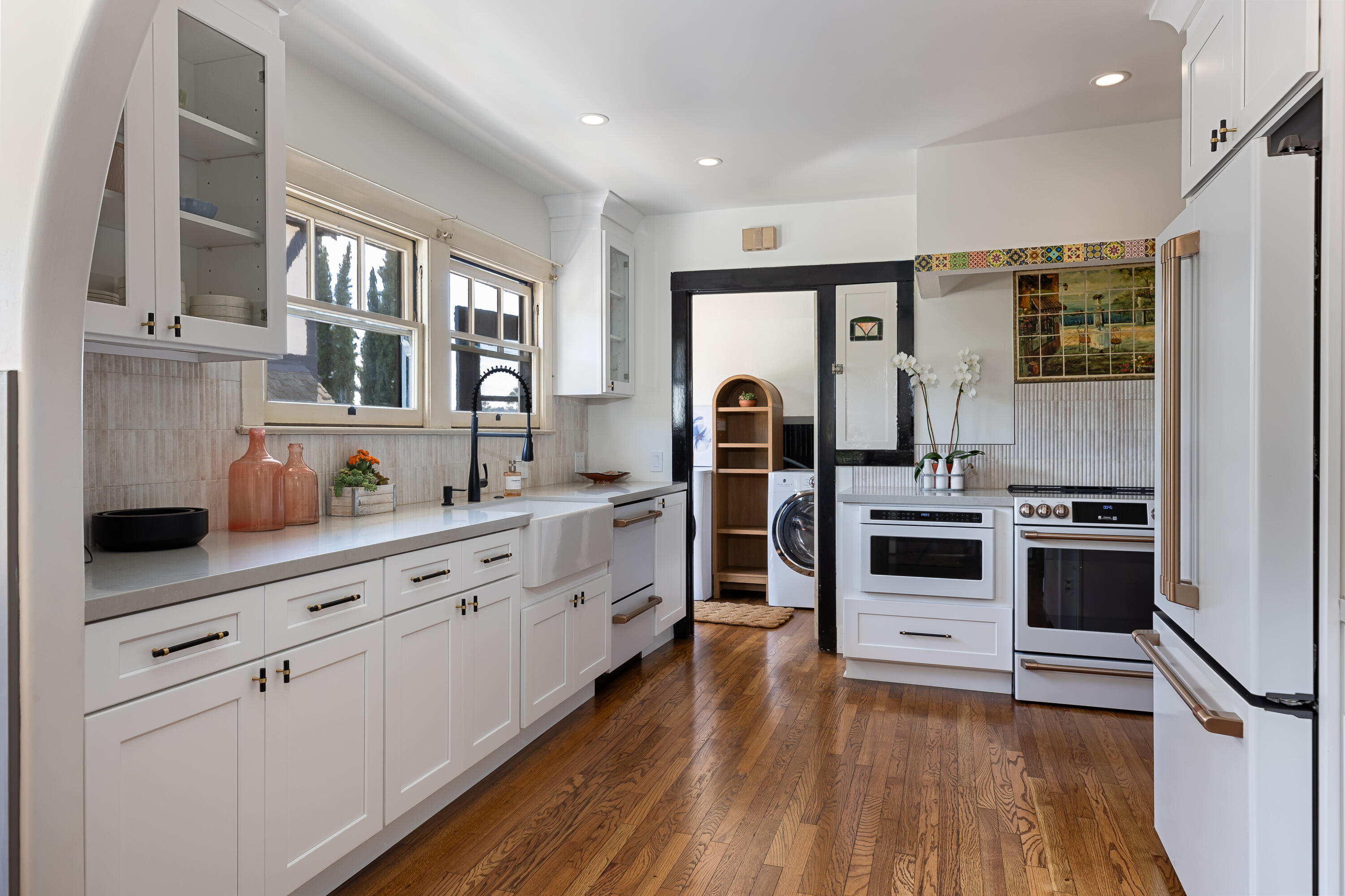 a kitchen with stainless steel appliances a stove sink and refrigerator