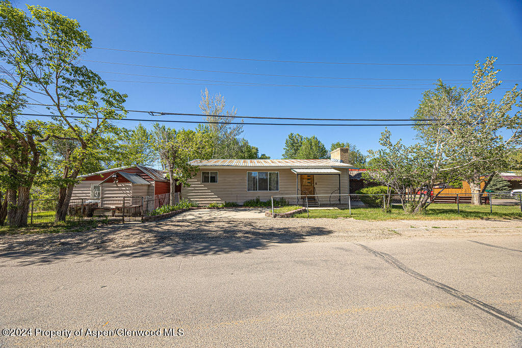 a view of a house with a street