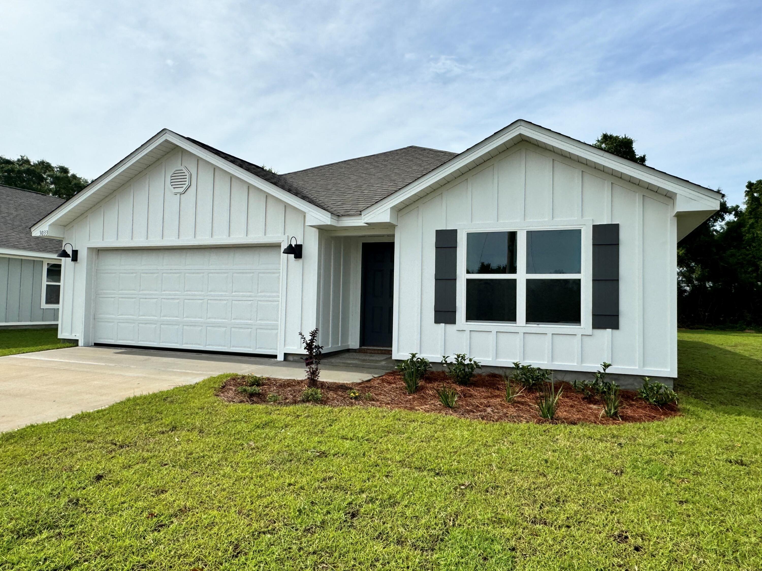 a front view of a house with yard