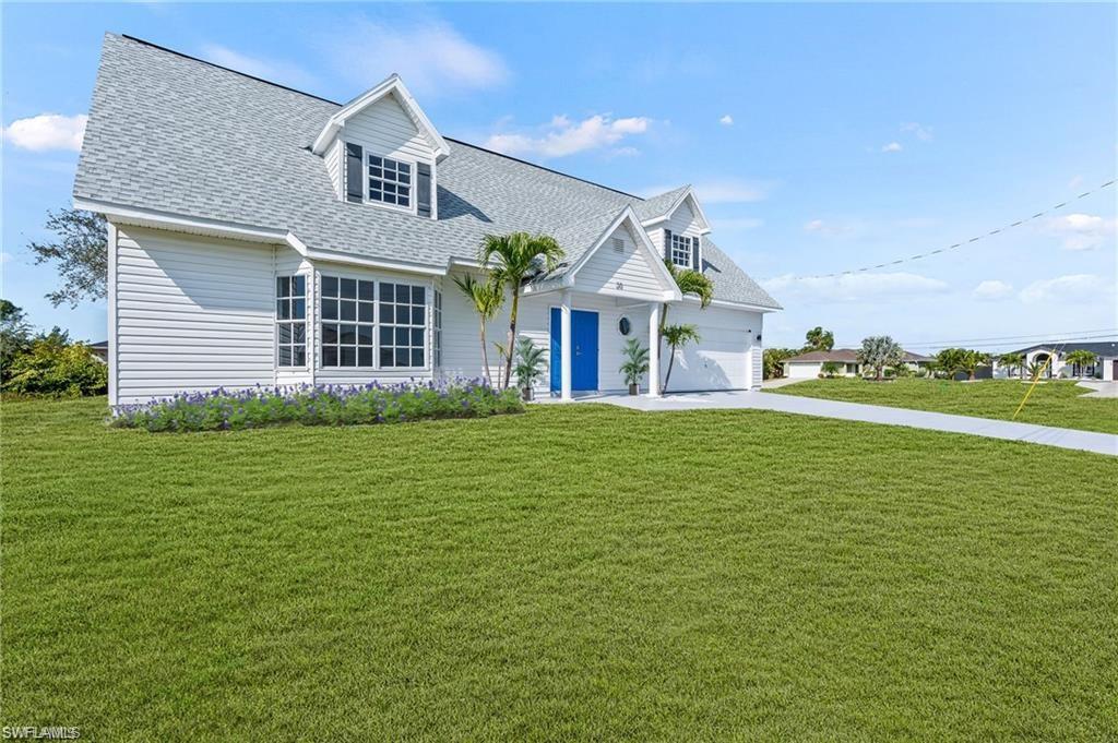 a front view of a house with a garden