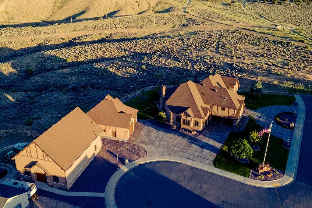 an aerial view of a house with a ocean view