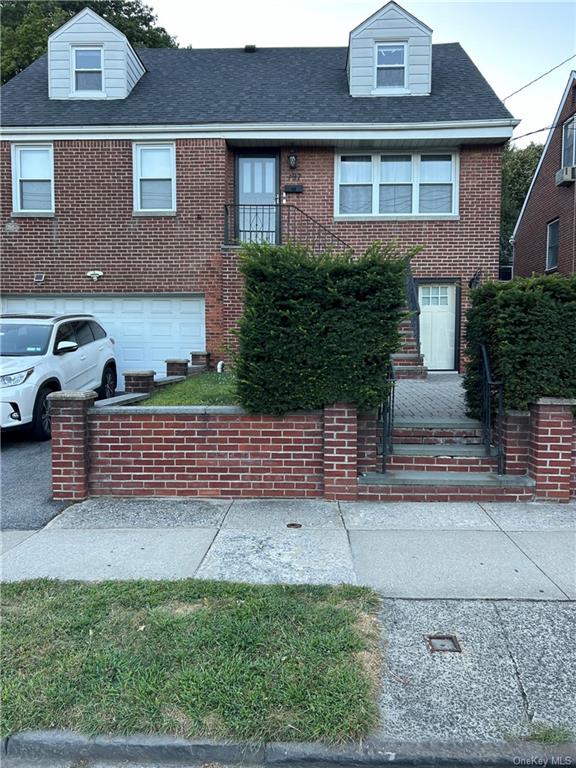 View of front facade featuring a garage