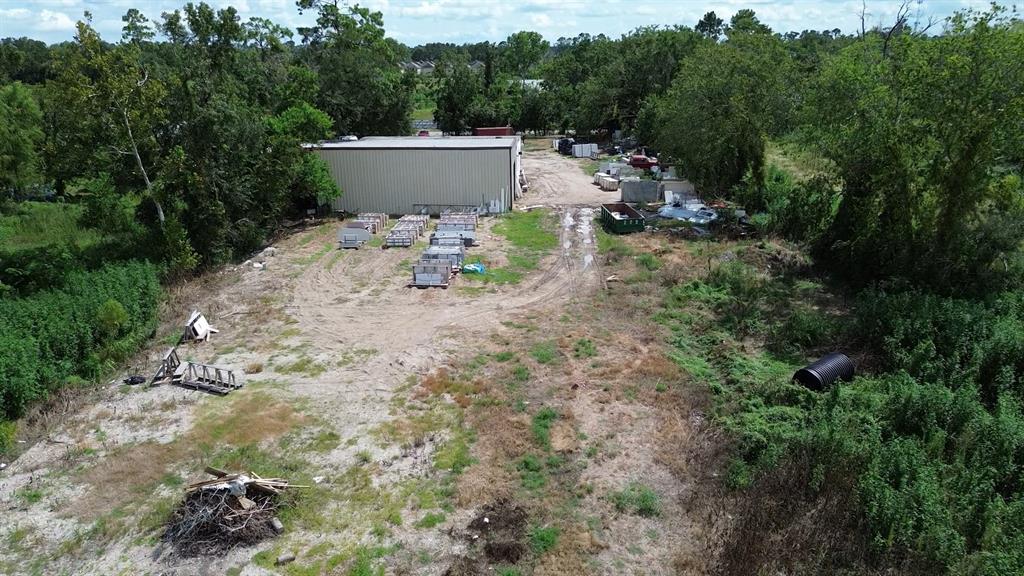 a view of backyard of house with outdoor seating and green space