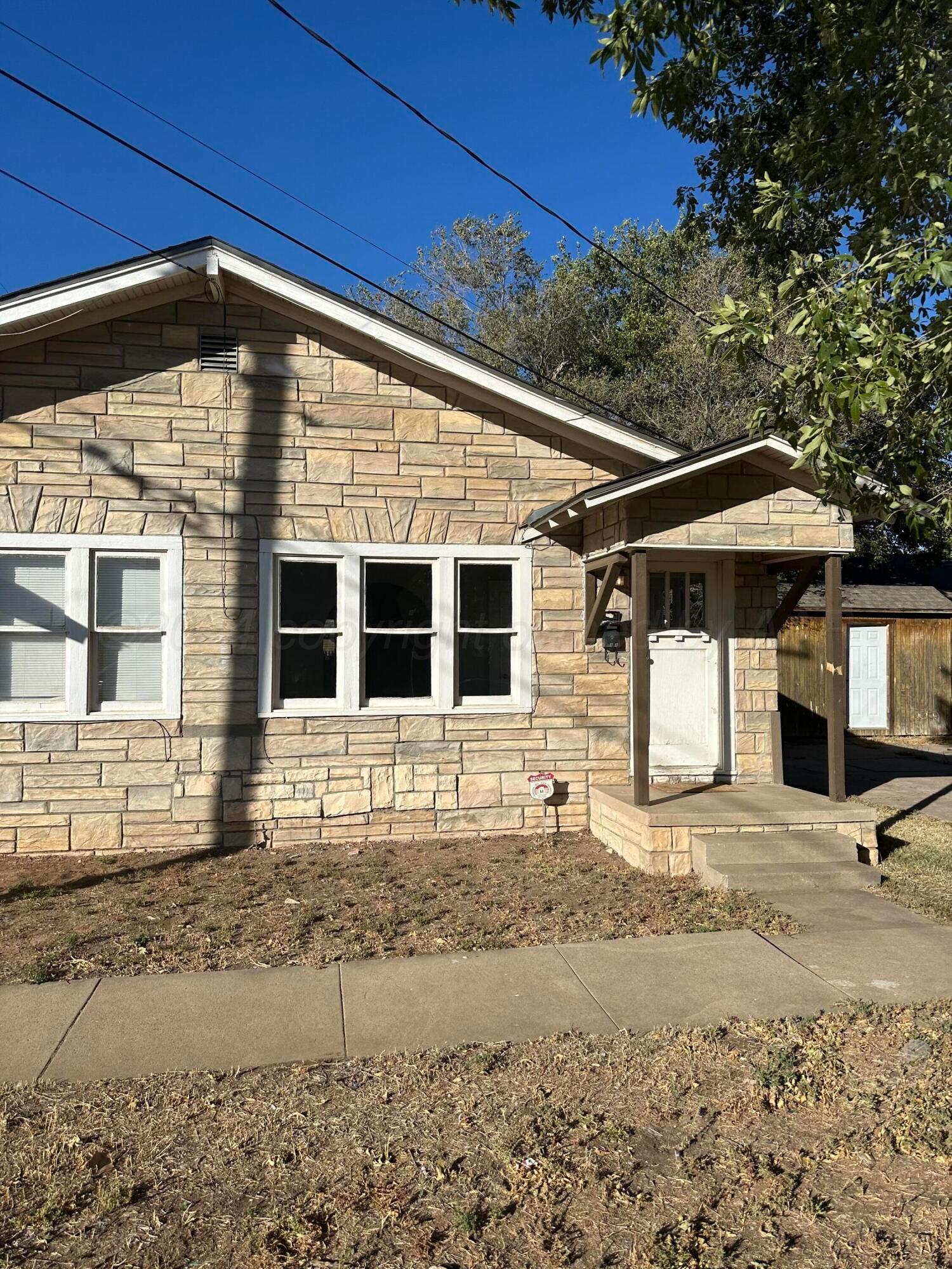 a front view of a house with basket ball court