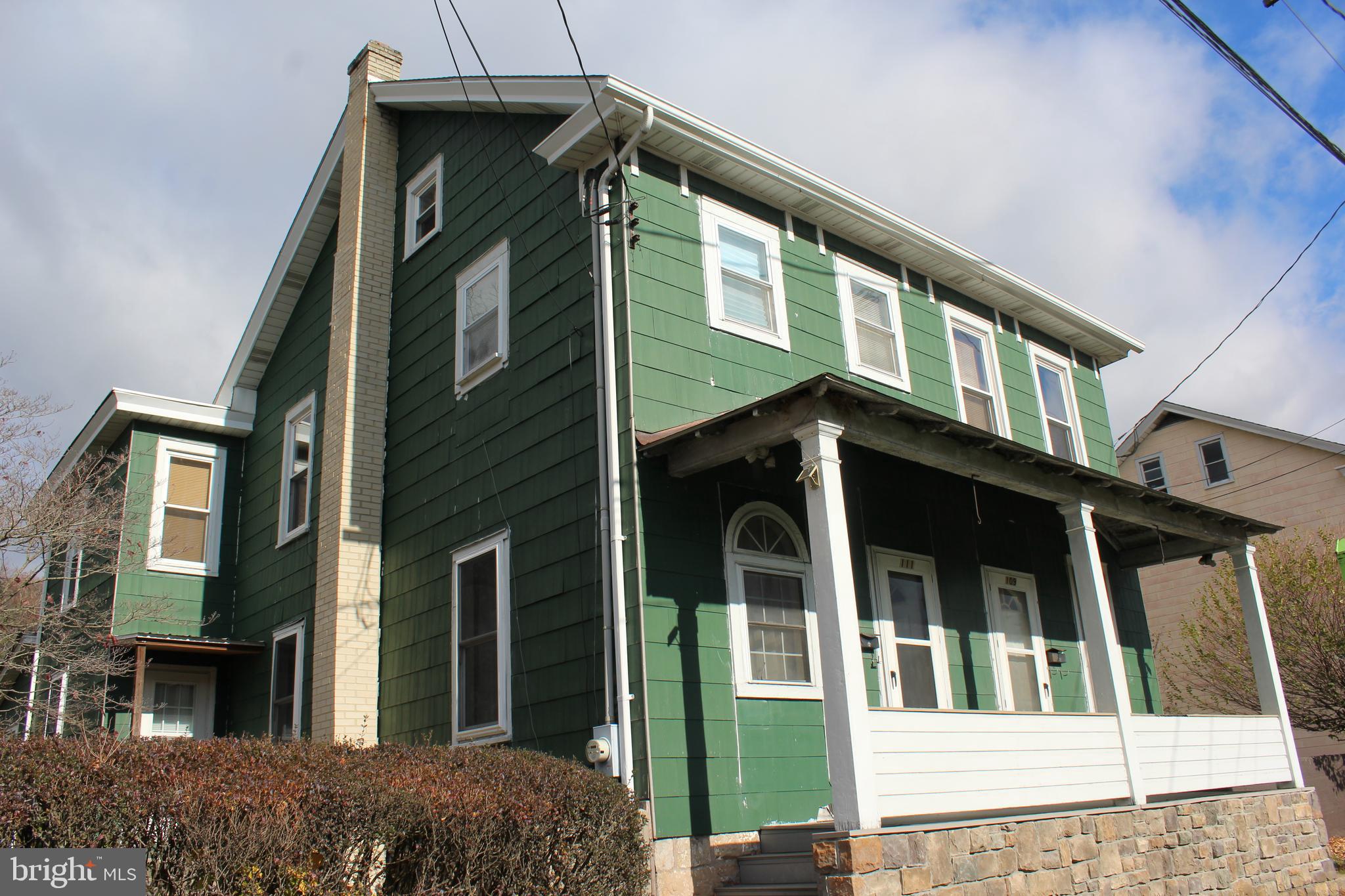 a front view of a house with glass windows