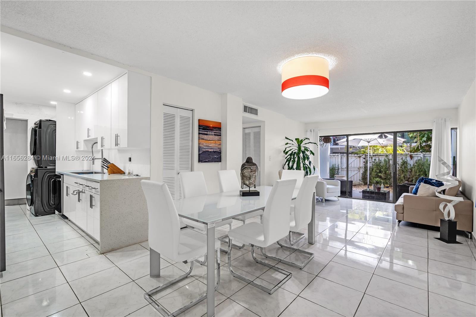 a view of kitchen with cabinets and outdoor seating