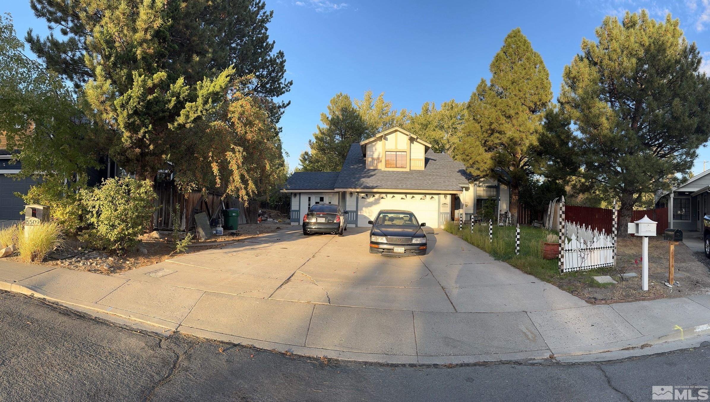 a view of a house with palm trees