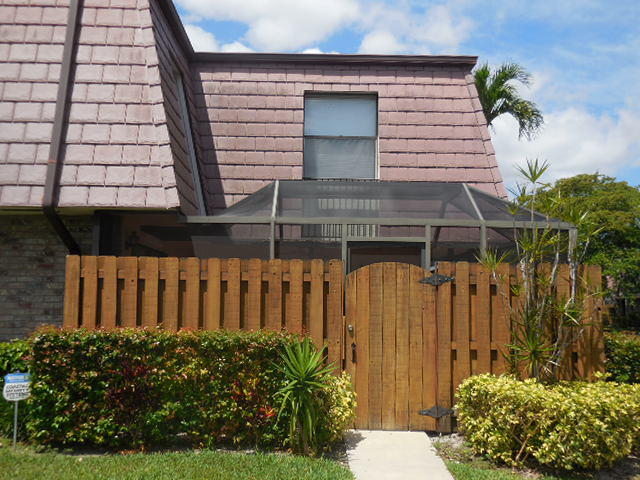 a front view of a house having yard