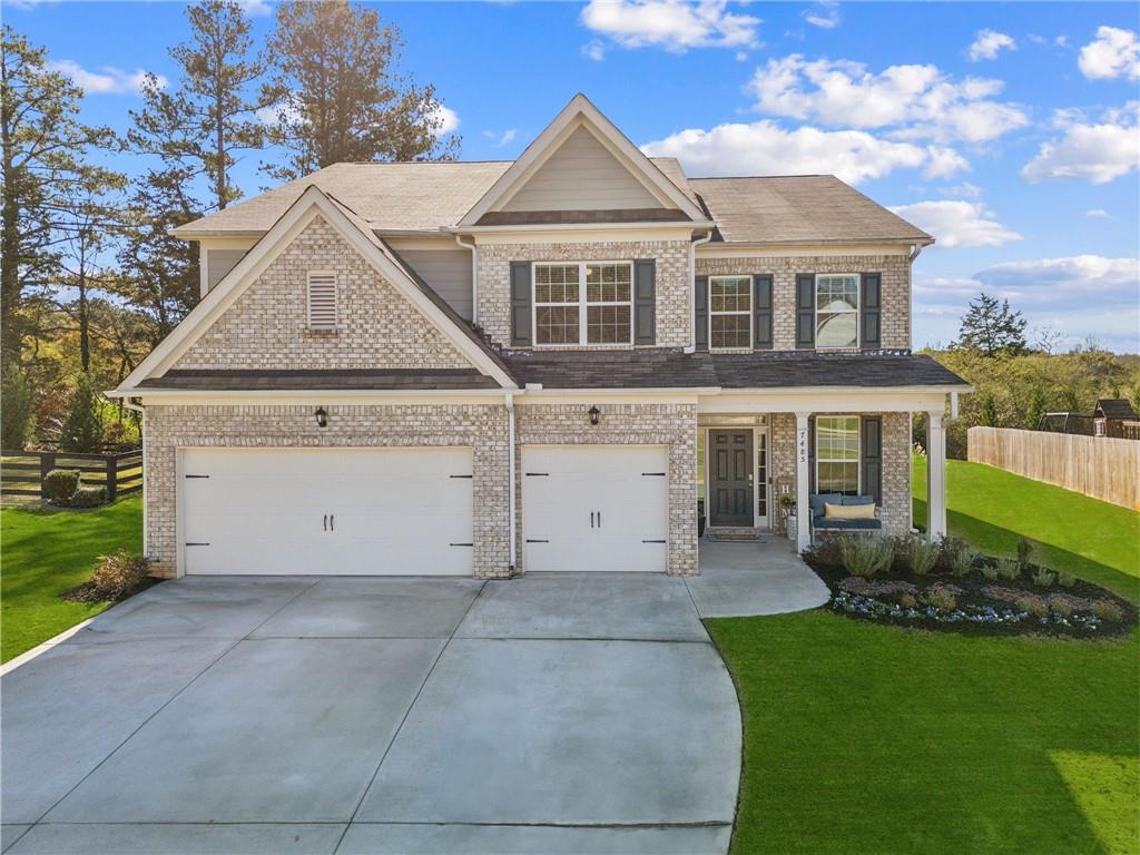 a view of a house with a yard