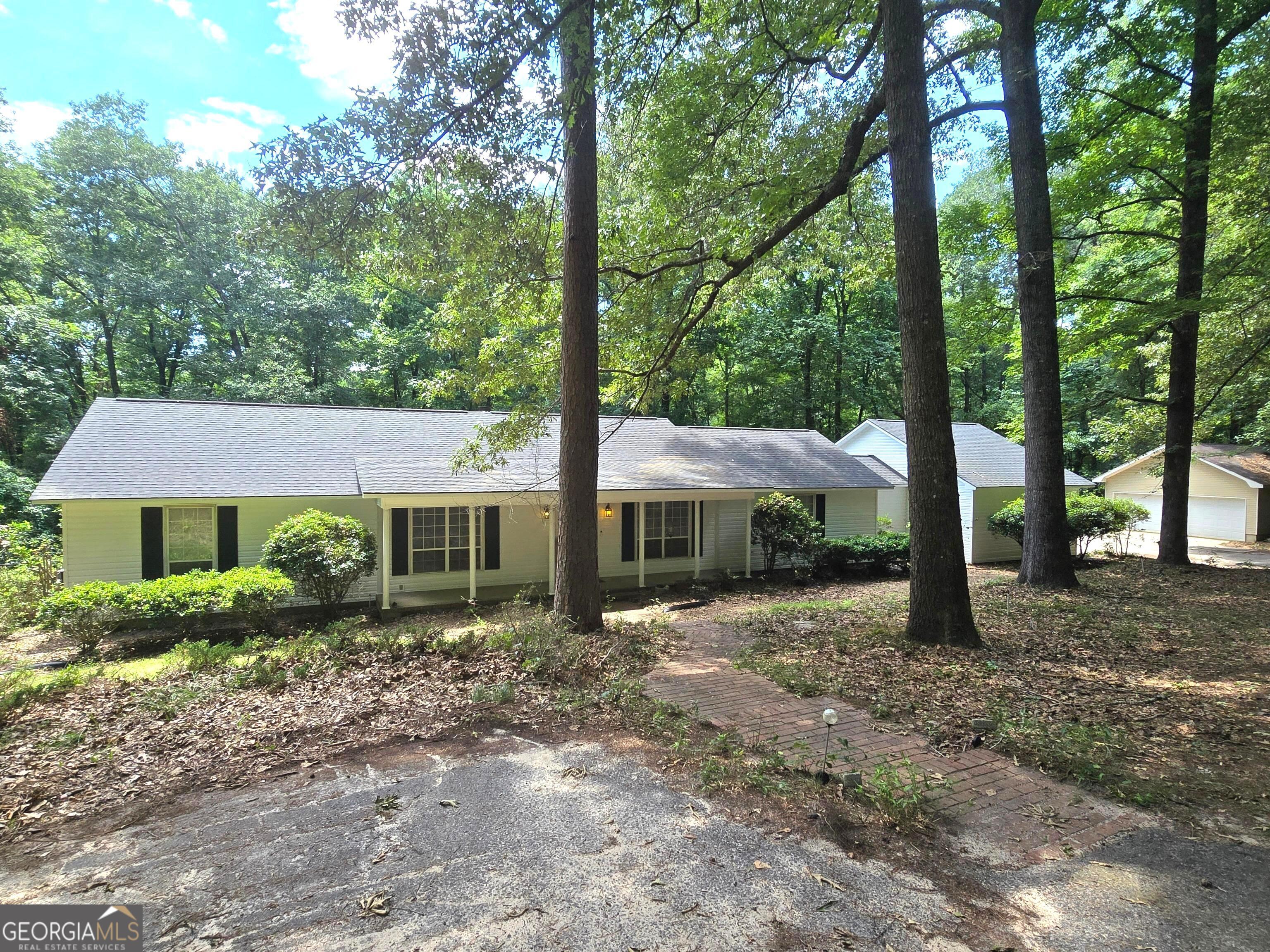 a house with trees in front of it