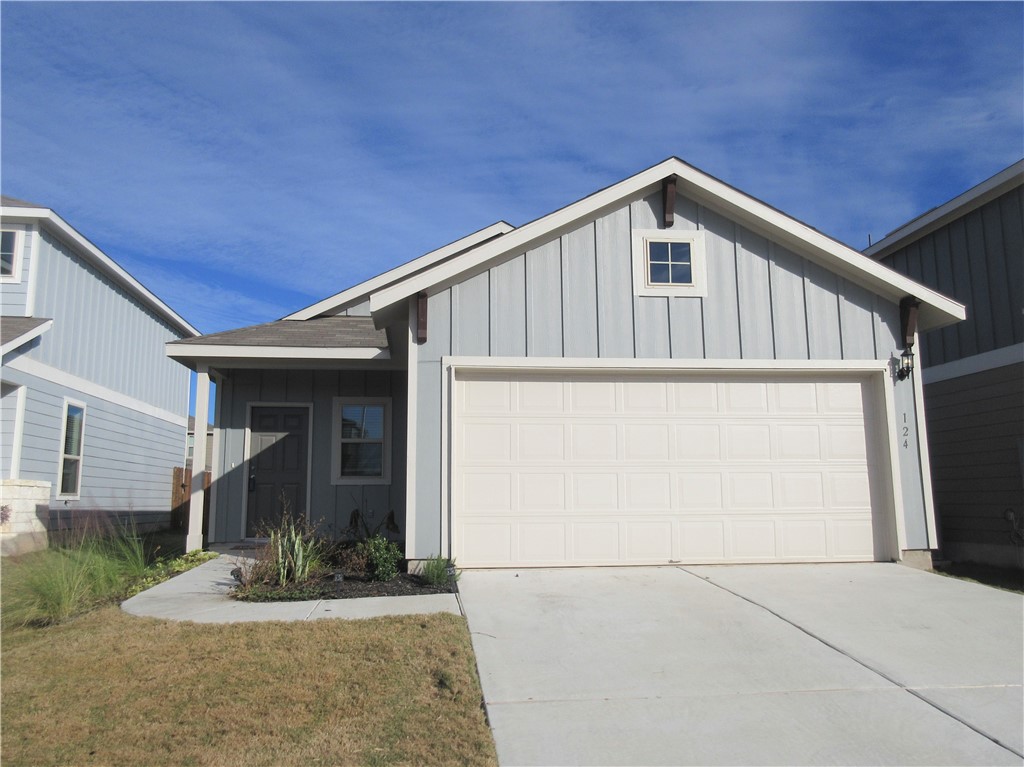 a front view of a house with garage