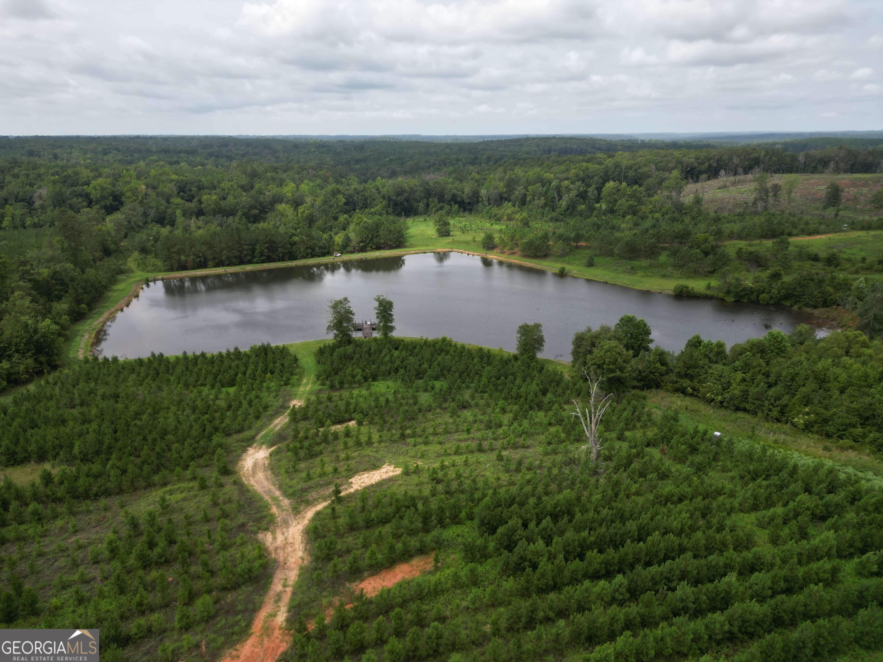 a view of a lake with a yard