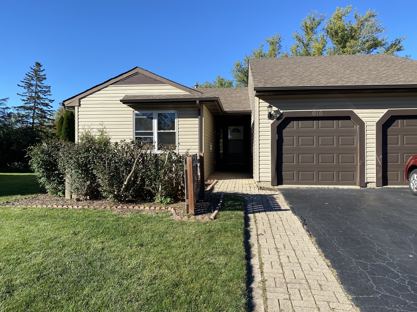 a front view of a house with a yard