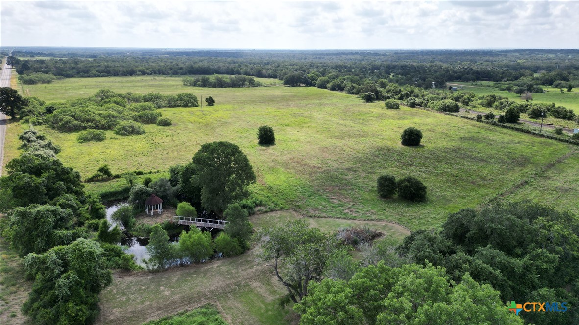 an aerial view of a houses with outdoor space