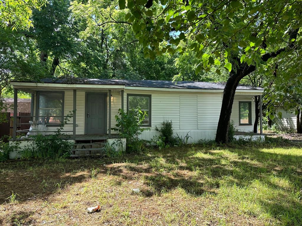 a house with a tree in front of it