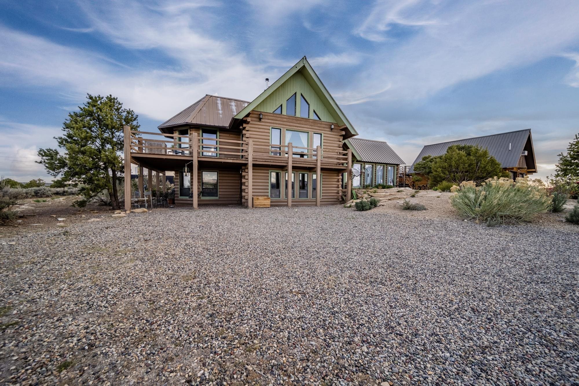 a view of house with outdoor space and sitting area