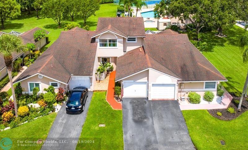 a aerial view of a house with a yard