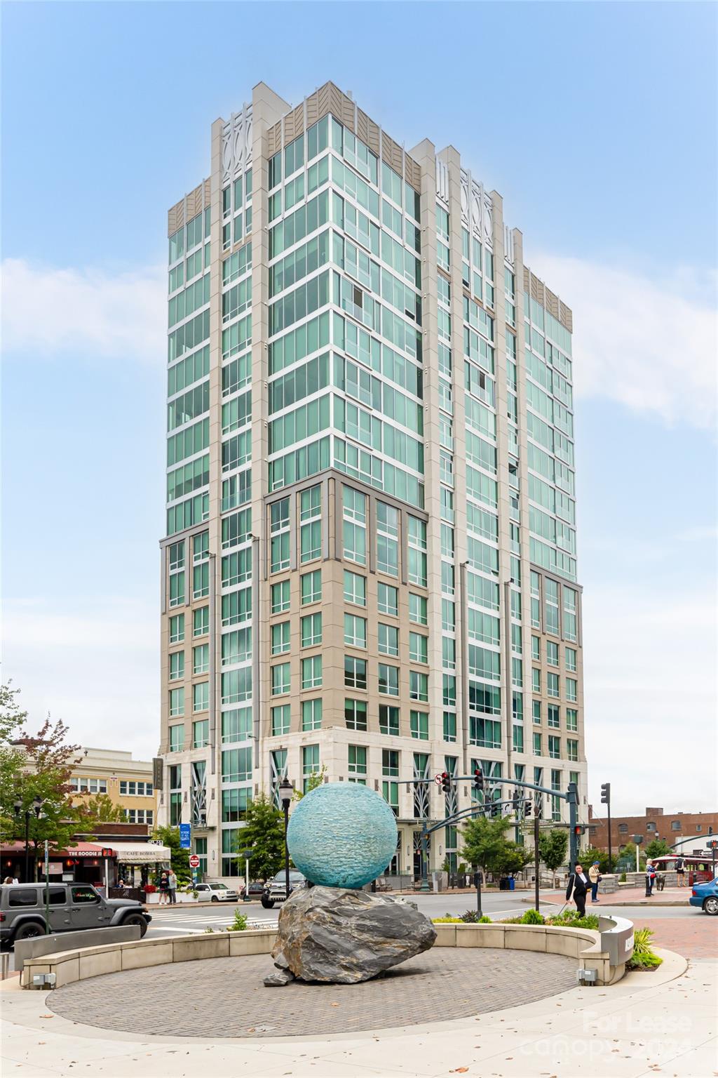 a front view of a building with a street