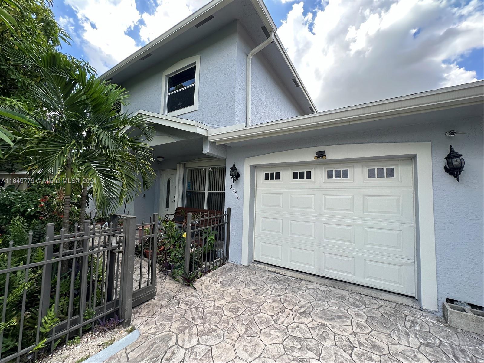 a view of a house with backyard space