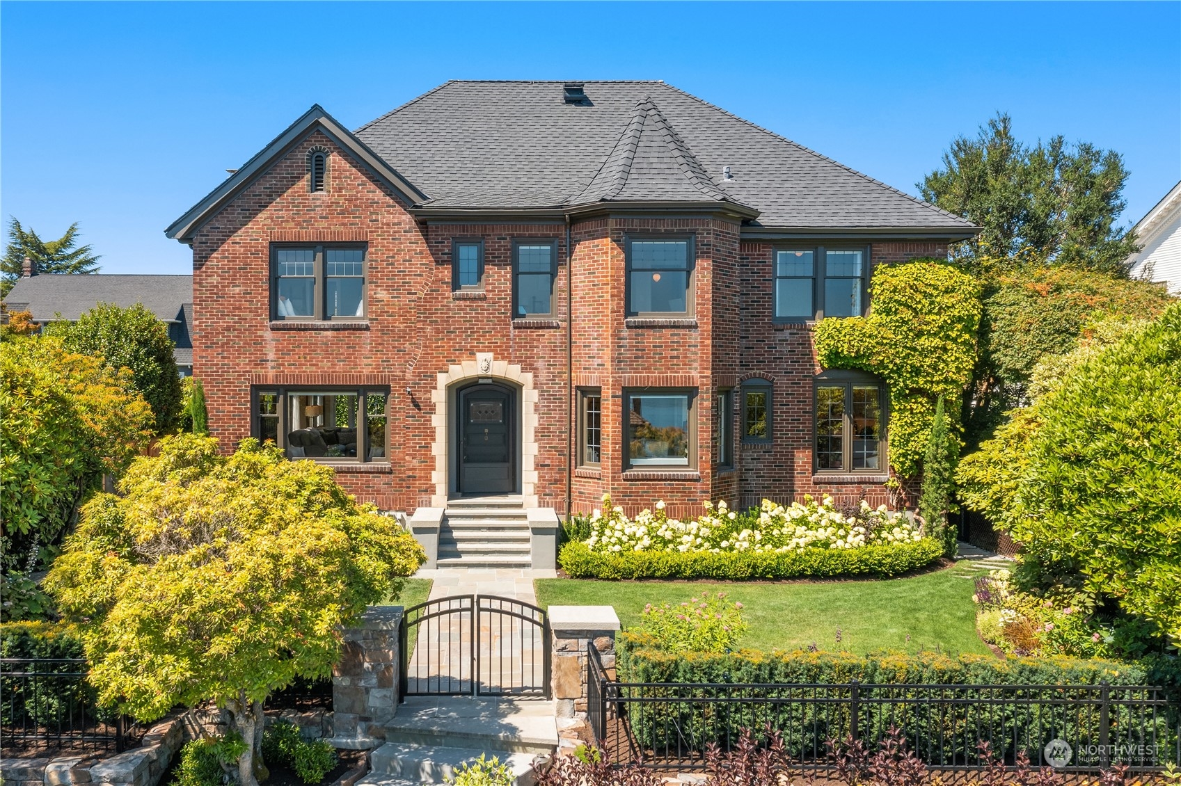 a front view of a house with garden