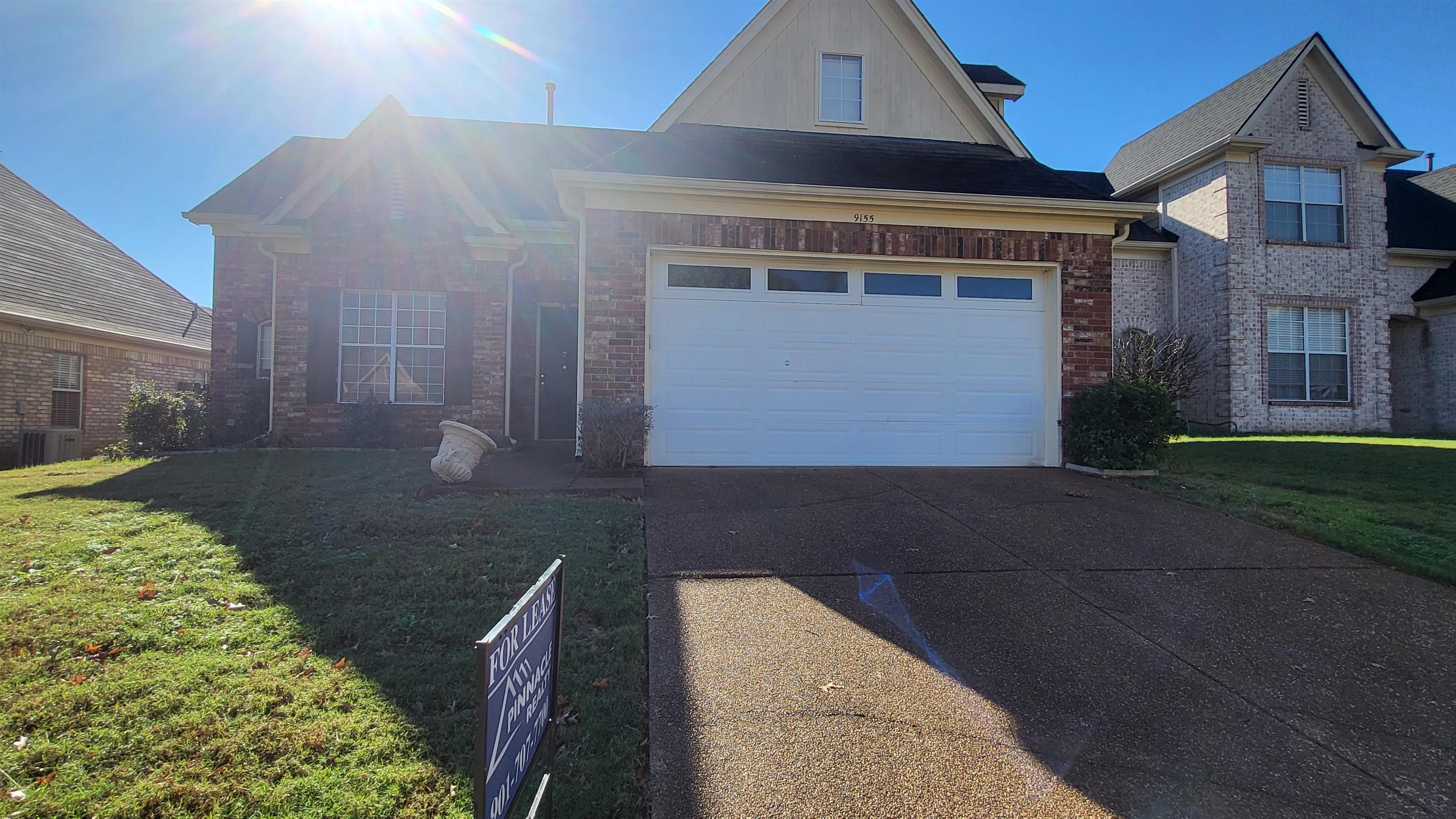 View of front of house featuring a front yard and central AC