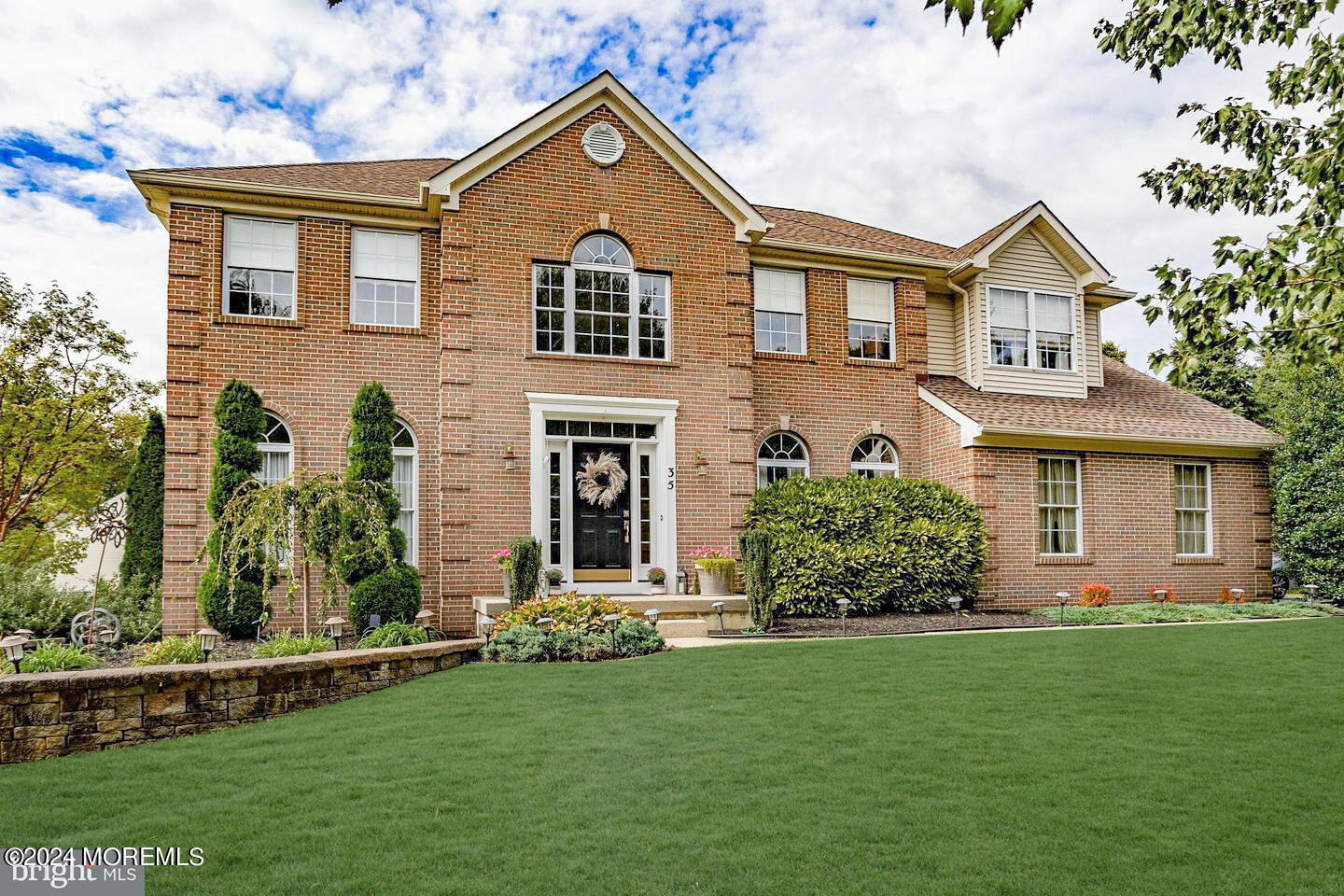 front view of a house with a yard