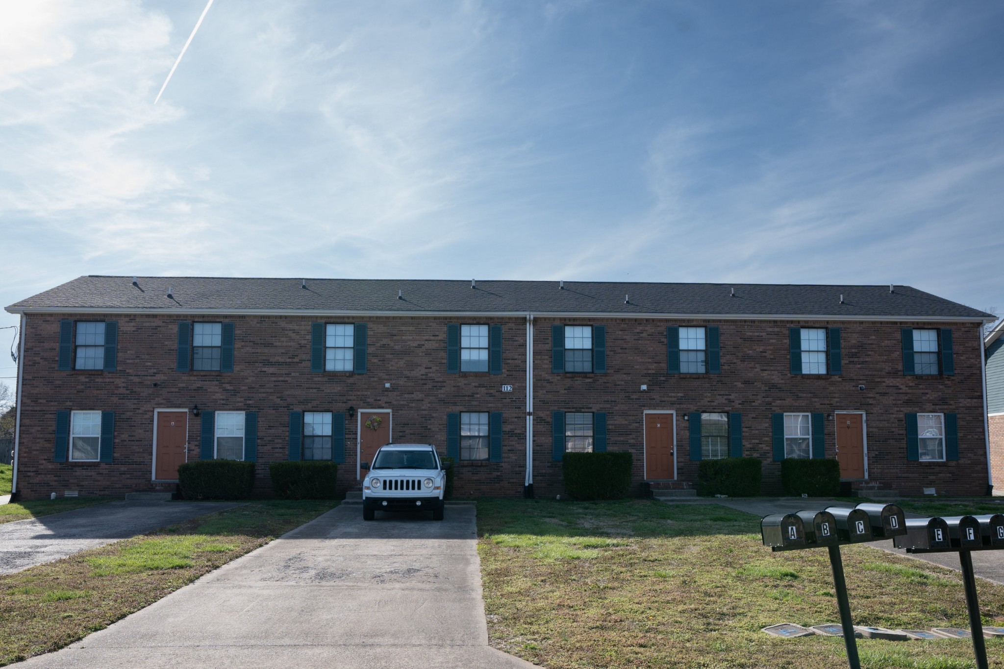 a front view of a building with garden