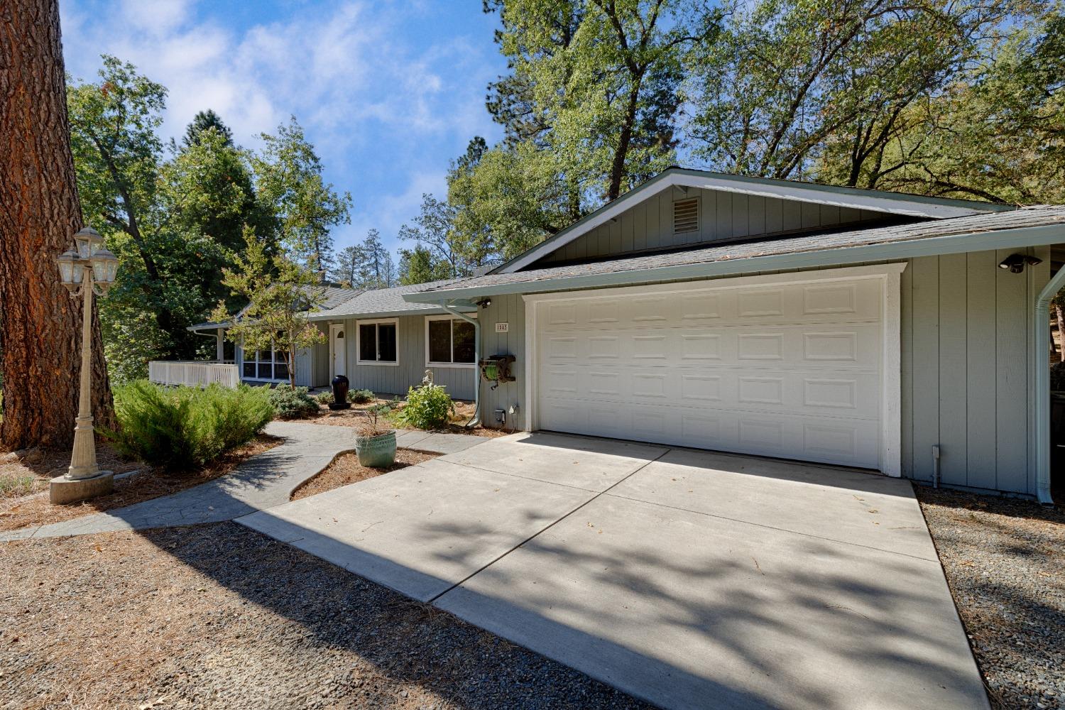 a backyard of a house with yard and outdoor seating