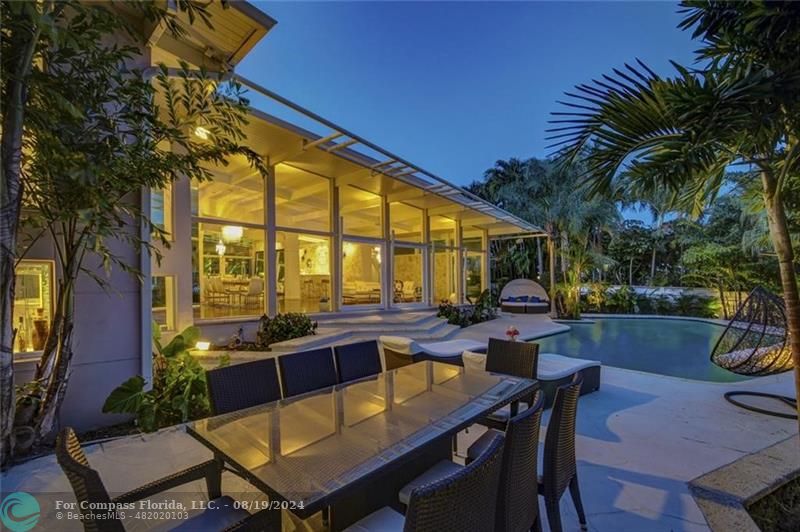 a view of a patio with swimming pool