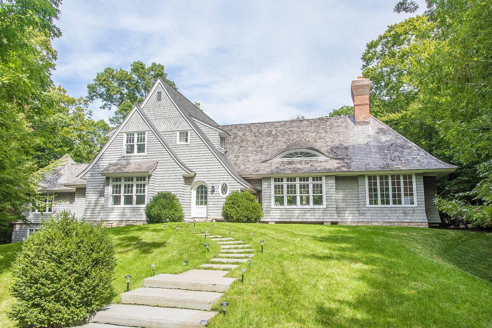 a front view of a house with garden