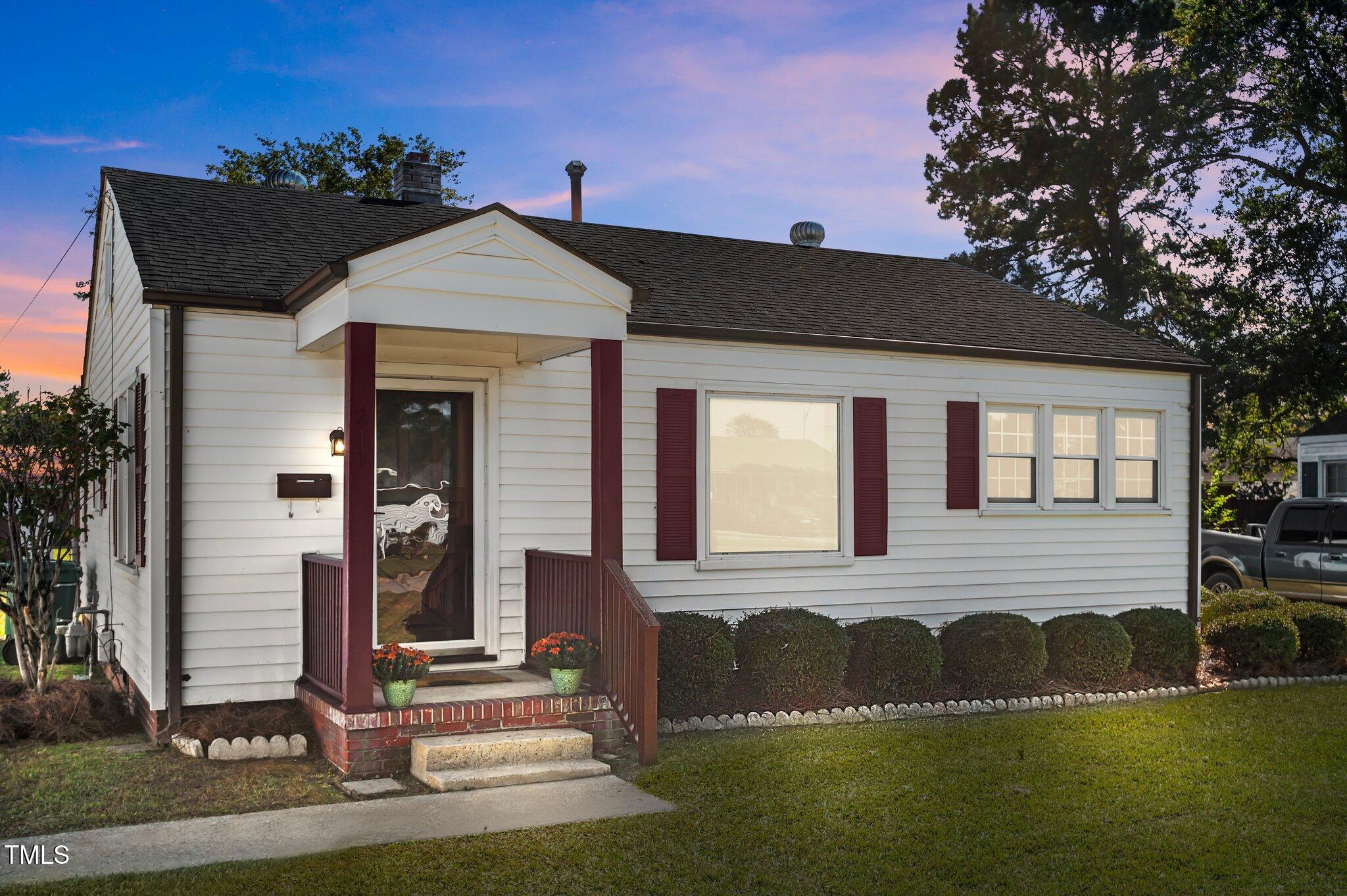 a front view of a house with a yard