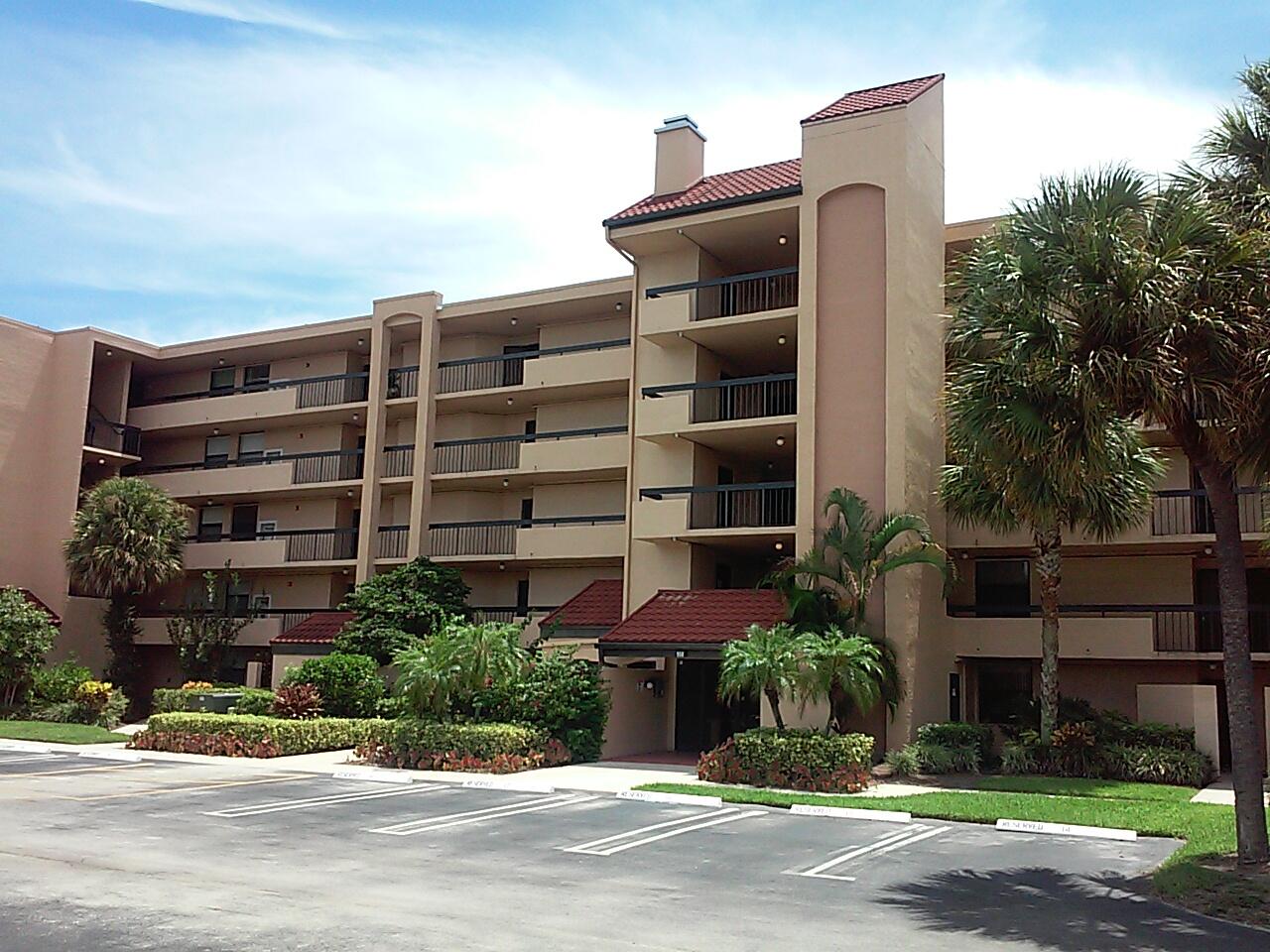 a front view of building with yard