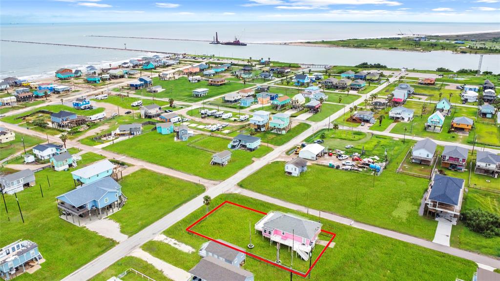 CHARMING COASTAL PROPERTY, OUTLINED IN RED, IS LOCATED JUST A SHORT WALK FROM THE BEACH, OFFERING PRIME ACCESS TO THE WATER AND STUNNING OCEAN VIEWS.