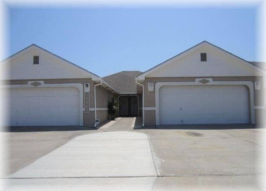 a front view of a house with a garage